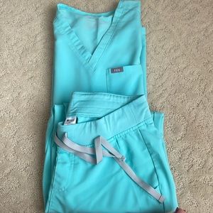 Like new , FIGS scrubs , teal , size small top , bottoms are joggers size small